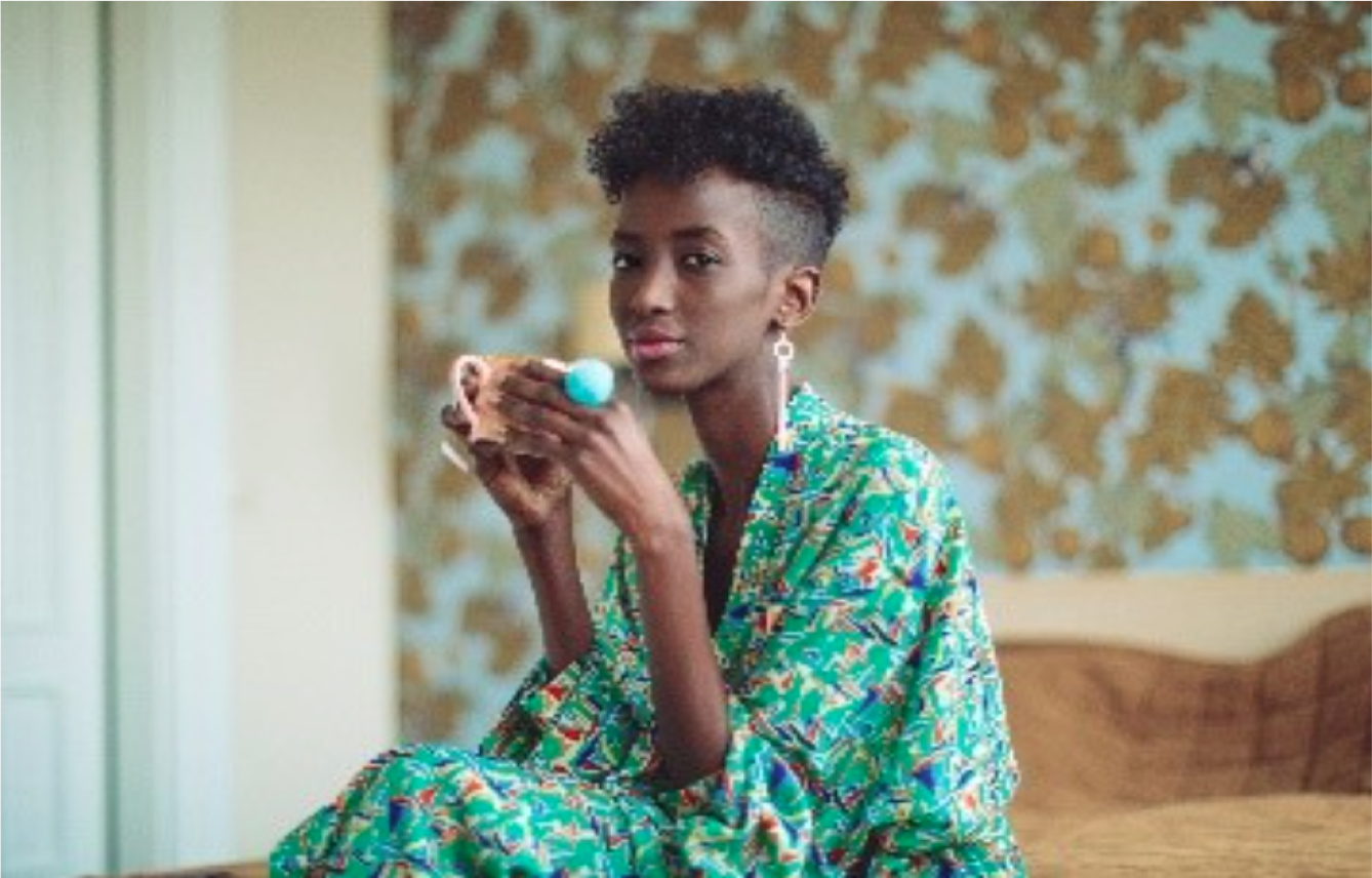 A Young Attractive Female Individual Having A Coffee Or Tea